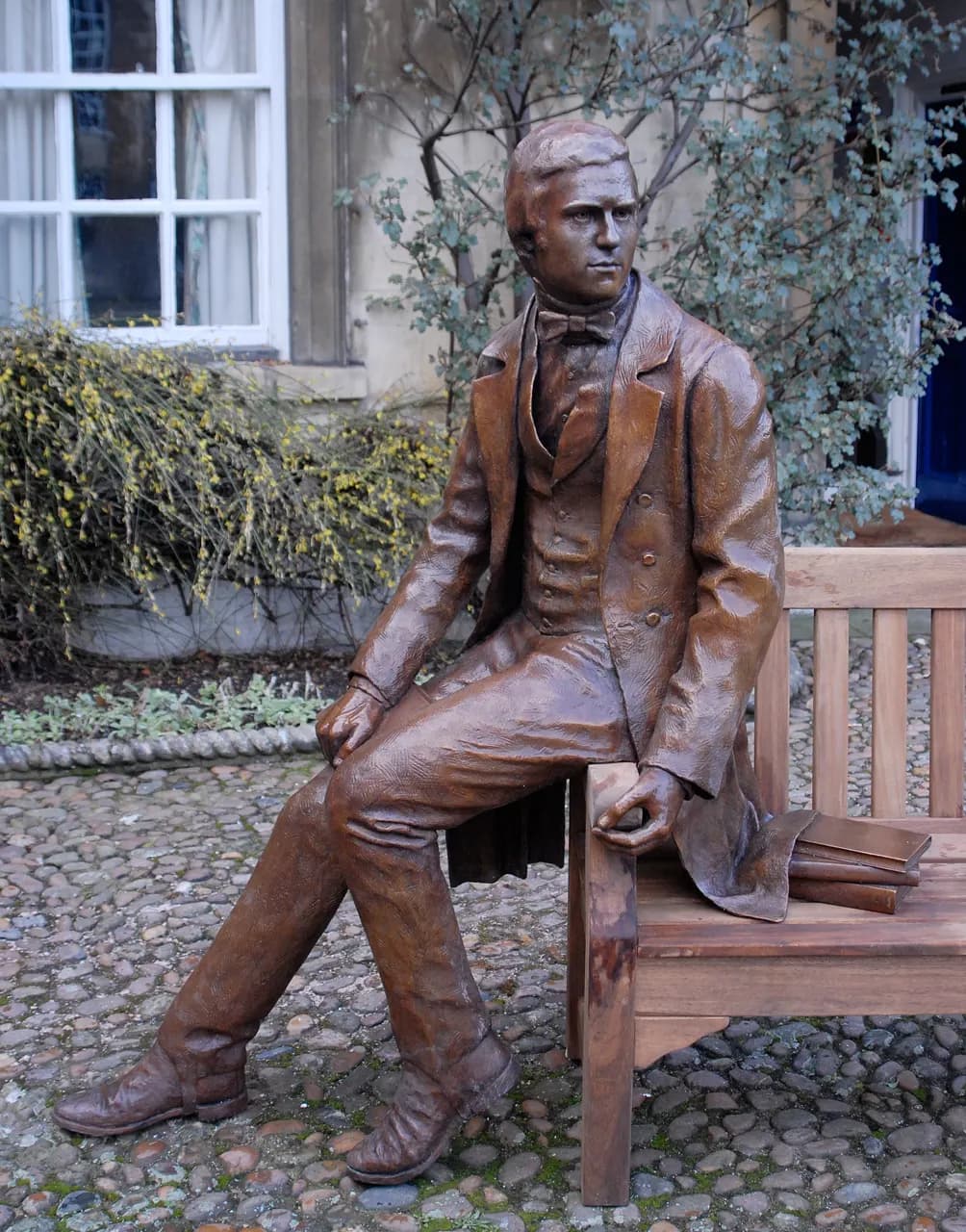 Life-sized bronze statue of the young (age 22) Charles Darwin at Christ's College, Cambridge. Sculpted by the British artist Anthony Smith. Shown here in the co