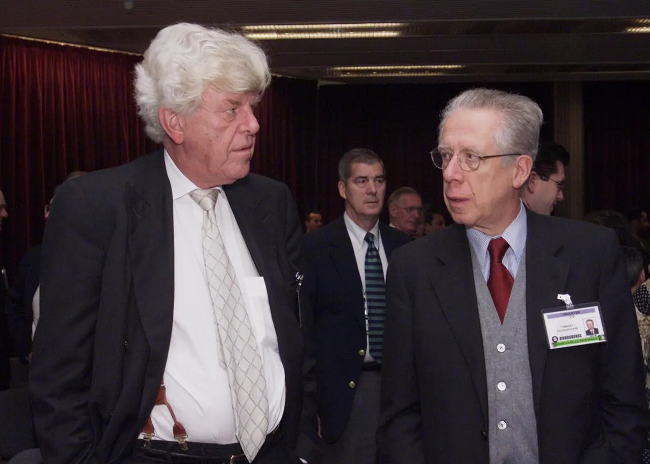 European Central Bank President Wim Duisenberg, left, and ECB Board Member Tommaso Padoa-Schioppa ahead of the International Monetary and Financial Committee me