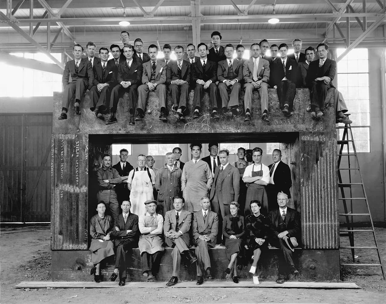 Archival photograph of the University of California Radiation Laboratory staff on the magnet yoke used to construct the 60-inch cyclotron. Taken around 1938. E.