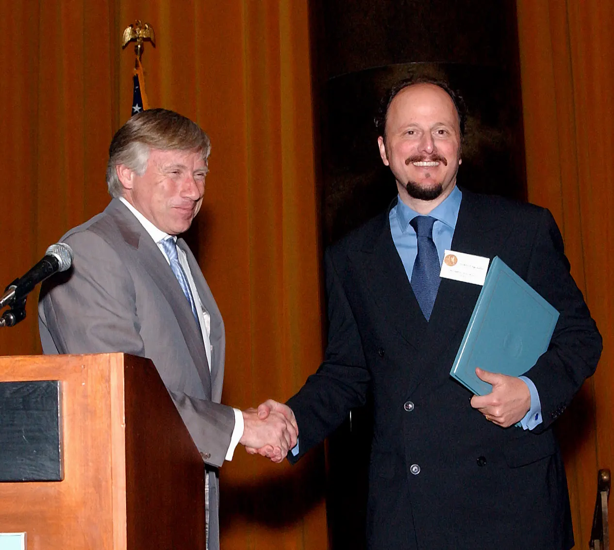 Columbia University President Lee C. Bollinger (left) presents Jeffrey Eugenides with the 2003 Pulitzer Prize in Fiction.