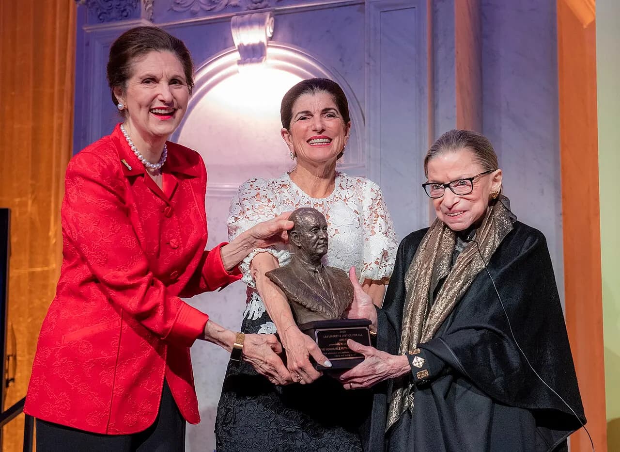 U.S. Supreme Court Justice Ruth Bader Ginsburg, right, receives the LBJ Liberty &amp; Justice for All Award from Lynda Johnson Robb, left, and Luci Baines Johns