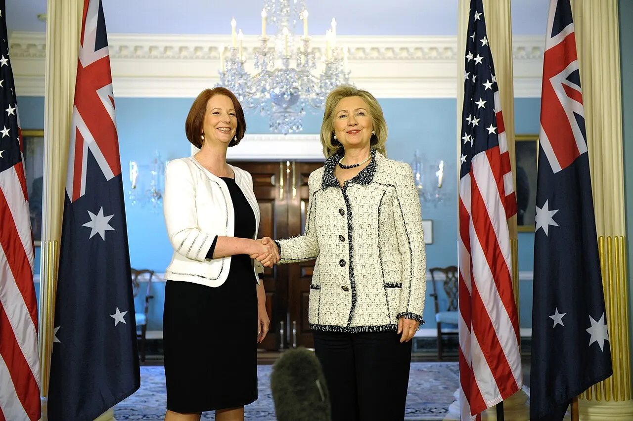 U.S. Secretary of State Hillary Rodham Clinton shakes hands with Australian Prime Minister Julia Gillard after their bilateral meeting at the U.S. Department of