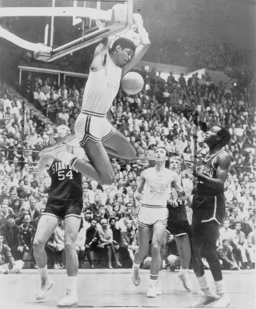 Lew Alcindor Kareem Abdul-Jabbar reaches over backwards to score