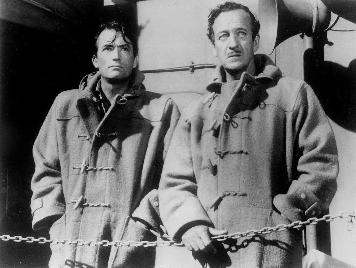 Publicity photo of Gregory Peck &amp; David Niven taken for film The Guns of Navarone (1961). See also film still. No copyright notice.