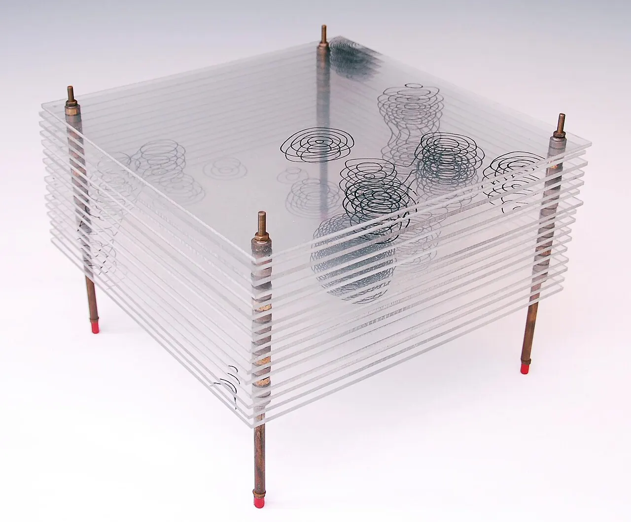 The model gives a three dimensional map of part of one of the crystal salts of penicillin. The contours are lines of electron density and show the positions of 