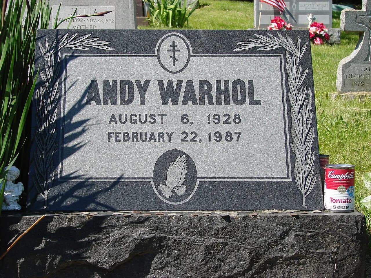 Grave of Andy Warhol. The can with tomato soup from Campbell's is not somebody's tasteless joke, but to honour one of Warhol's most famous series of pieces of a