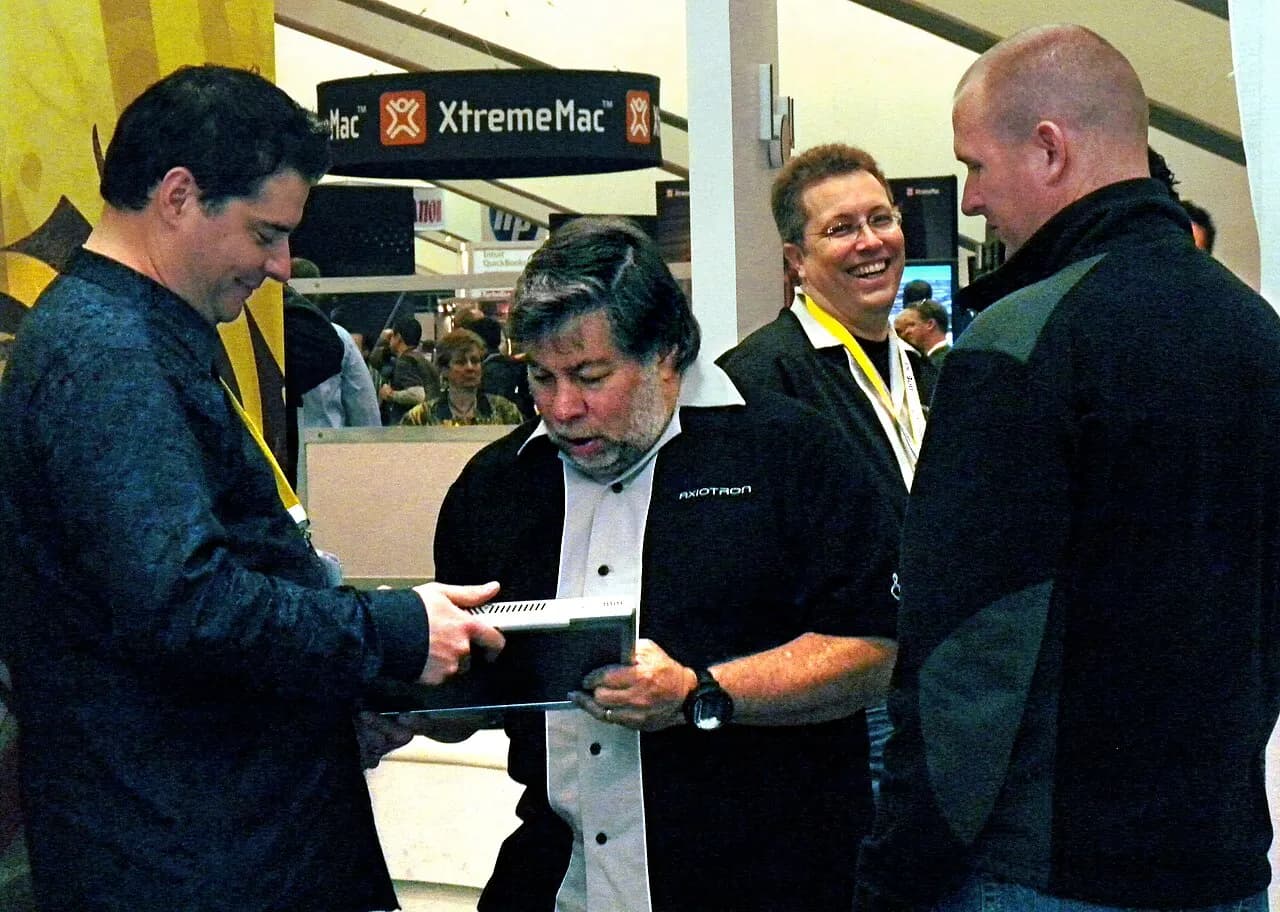 Steve Wozniak, co-founder of Apple, signs a Modbook for a fan during Macworld Expo 2009 while the CEO of Axiotron, Andreas Hass smiles on.